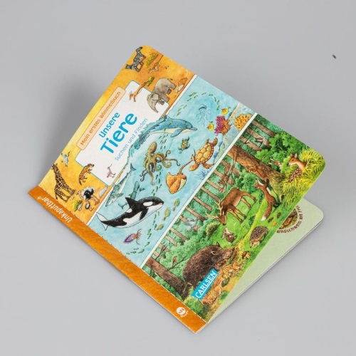 Buchcover und Innenansicht für das Buch: Unkaputtbar: Mein erstes Wimmelbuch: Unsere Tiere